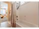 Bathroom with tub shower combo and updated fixtures at 9127 E Lynwood St, Mesa, AZ 85207