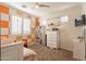 Bedroom with a trendy orange and white wall at 9127 E Lynwood St, Mesa, AZ 85207