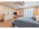 Bright bedroom with plantation shutters and sitting area at 9127 E Lynwood St, Mesa, AZ 85207