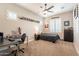 Bright bedroom with a built-in desk and a double bed at 9127 E Lynwood St, Mesa, AZ 85207