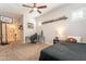 Bedroom with a bed, desk, and access to a bathroom at 9127 E Lynwood St, Mesa, AZ 85207