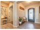 Spacious entryway with wood-look floors and bench at 9127 E Lynwood St, Mesa, AZ 85207