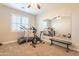 Home gym with a mirror and various workout equipment at 9127 E Lynwood St, Mesa, AZ 85207