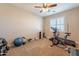 Home gym with exercise bike, treadmill and weights at 9127 E Lynwood St, Mesa, AZ 85207