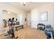 Home gym with stationary bike, weights, and mirror at 9127 E Lynwood St, Mesa, AZ 85207