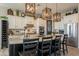 Island kitchen with granite countertops and wood cabinets at 9127 E Lynwood St, Mesa, AZ 85207