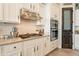 Well-equipped kitchen with gas cooktop, double oven, and ample counter space at 9127 E Lynwood St, Mesa, AZ 85207