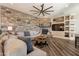 Living room with a cozy stone fireplace and hardwood floors at 9127 E Lynwood St, Mesa, AZ 85207