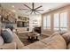 Spacious living area with stone fireplace and large windows at 9127 E Lynwood St, Mesa, AZ 85207