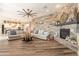 Spacious living room features a stone fireplace and comfortable seating at 9127 E Lynwood St, Mesa, AZ 85207