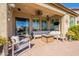 Covered patio furnished with comfortable seating and a firepit at 9127 E Lynwood St, Mesa, AZ 85207