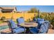 Fire pit table and four chairs for al fresco dining at 9127 E Lynwood St, Mesa, AZ 85207