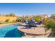 Peaceful poolside patio furniture with mountain views at 9127 E Lynwood St, Mesa, AZ 85207