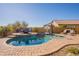Relaxing pool area with brick patio and comfortable seating at 9127 E Lynwood St, Mesa, AZ 85207