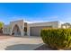 Front yard view of a ranch house with a gray garage door at 9226 W Glen Oaks N Cir, Sun City, AZ 85351