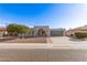 House exterior showcasing a gray garage and a brick facade at 9226 W Glen Oaks N Cir, Sun City, AZ 85351