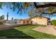 Spacious backyard with swimming pool, grassy area, and brick patio at 9607 N 41St Dr, Phoenix, AZ 85051