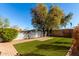 Landscaped backyard with artificial turf at 9607 N 41St Dr, Phoenix, AZ 85051