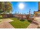 Landscaped backyard featuring a swimming pool and brick paved patio at 9607 N 41St Dr, Phoenix, AZ 85051