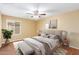 Virtually staged bedroom with a king-size bed and neutral decor at 9607 N 41St Dr, Phoenix, AZ 85051