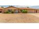 Single story home with well-manicured landscaping and a gravel driveway at 9607 N 41St Dr, Phoenix, AZ 85051