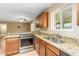 Modern kitchen features granite countertops and stainless steel appliances at 9607 N 41St Dr, Phoenix, AZ 85051