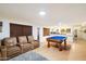 Finished basement with a pool table and theater seating at 10232 N 54Th Pl, Paradise Valley, AZ 85253