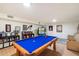 Finished basement recreation room with pool table, comfortable seating, and shelving at 10232 N 54Th Pl, Paradise Valley, AZ 85253