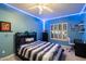 Blue bedroom with LED lighting and built-in shelving at 10232 N 54Th Pl, Paradise Valley, AZ 85253