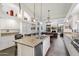 Large kitchen with granite island, white cabinets and breakfast area at 10232 N 54Th Pl, Paradise Valley, AZ 85253