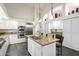 Updated kitchen with granite island and white cabinets at 10232 N 54Th Pl, Paradise Valley, AZ 85253