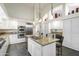 Bright kitchen featuring granite countertops, stainless steel appliances, and white cabinets at 10232 N 54Th Pl, Paradise Valley, AZ 85253