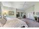 Spacious main bedroom with backyard access and ceiling fan at 10232 N 54Th Pl, Paradise Valley, AZ 85253
