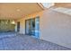 Covered patio with sliding doors and pavers leading to backyard at 10405 N 65Th Dr, Glendale, AZ 85302