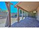 Covered patio with pavers and curtains, overlooking a grassy backyard at 10405 N 65Th Dr, Glendale, AZ 85302
