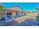 Covered patio with pavers, pergola, and curtains, overlooking a grassy backyard at 10405 N 65Th Dr, Glendale, AZ 85302