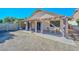 Covered patio with pavers, pergola, and curtains, overlooking a grassy backyard at 10405 N 65Th Dr, Glendale, AZ 85302