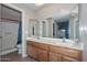 Bathroom boasts double sinks and a shower/tub combo at 10405 N 65Th Dr, Glendale, AZ 85302