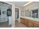 Double vanity bathroom with walk-in shower and closet at 10405 N 65Th Dr, Glendale, AZ 85302