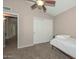 Comfortable bedroom with a twin bed and double door closet at 10405 N 65Th Dr, Glendale, AZ 85302