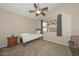Cozy bedroom with a twin bed and a ceiling fan at 10405 N 65Th Dr, Glendale, AZ 85302