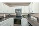 Modern kitchen with stainless steel appliances and granite countertops at 10405 N 65Th Dr, Glendale, AZ 85302