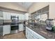 Updated kitchen with stainless steel appliances and ample counter space at 10405 N 65Th Dr, Glendale, AZ 85302
