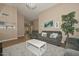 Bright and airy living room with ample seating and views to the dining area at 10405 N 65Th Dr, Glendale, AZ 85302