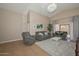 Relaxing living room with comfortable seating and access to backyard at 10405 N 65Th Dr, Glendale, AZ 85302
