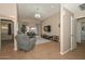 Open living room with high ceilings and access to hallway at 10405 N 65Th Dr, Glendale, AZ 85302