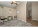 Sitting area with neutral walls and a ceiling fan at 10405 N 65Th Dr, Glendale, AZ 85302