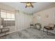 Sitting area with two chairs and a decorative shelf at 10405 N 65Th Dr, Glendale, AZ 85302