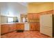 Kitchen with wood cabinets and tile flooring at 10555 W Woodruff Rd, Casa Grande, AZ 85194