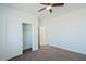 Well-lit bedroom with a double-door closet and carpet flooring at 12527 W Jenero Dr, Arizona City, AZ 85123